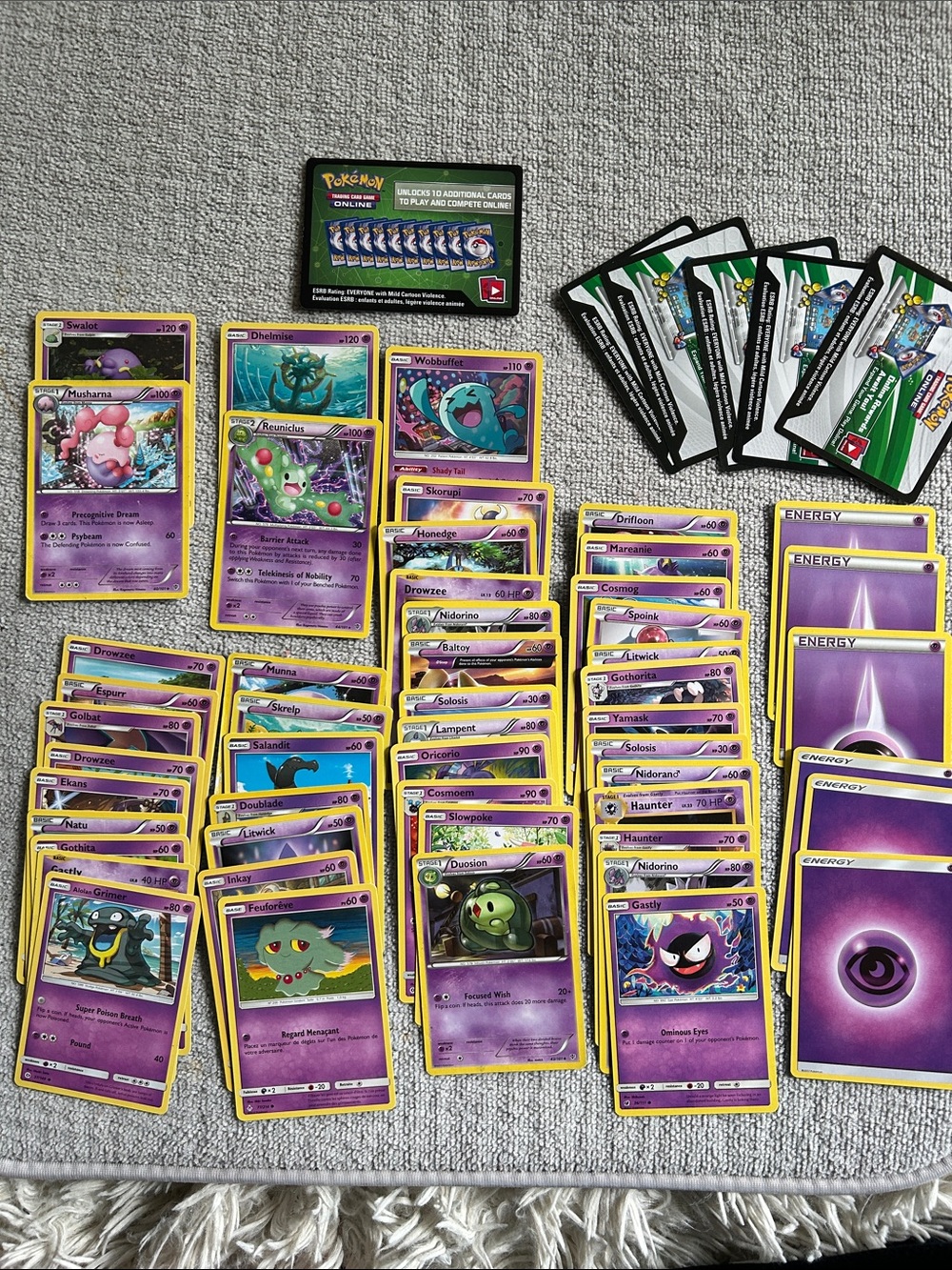 57 Purple Pokémon Collectible Playing and Trading Cards, energy, online codes